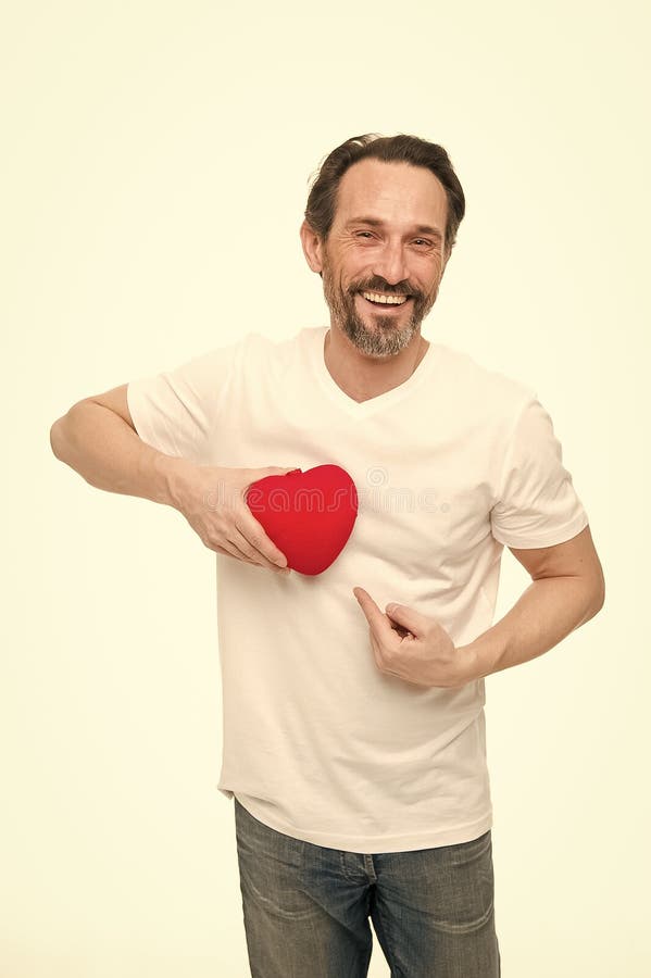 Valentines day. Health care. Mature bearded man with red heart. heart transplant. Holiday celebration. Love. problems royalty free stock images Valentines day. Health care. Mature bearded man with red heart. heart transplant. Holiday celebration. Love. problems royalty free stock images
