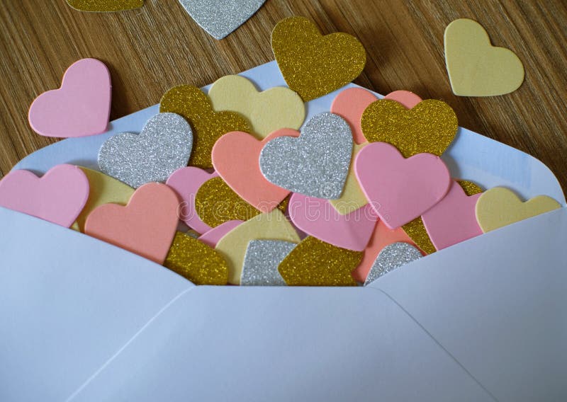 Valentines day love letter. opened envelope and many felt hearts