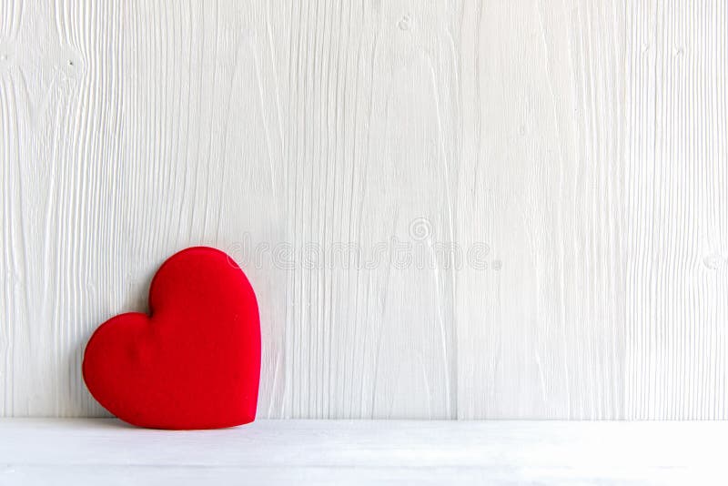 Valentineâ€™s Day. Sewed pillow red hearts clothespins on the white wood planks. Happy lovers day card mockup, copy space