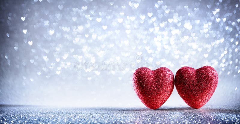 Valentinsgruß-Karte - zwei glänzende Herzen