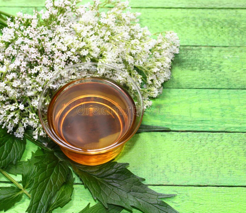 Valerian tea on green boards