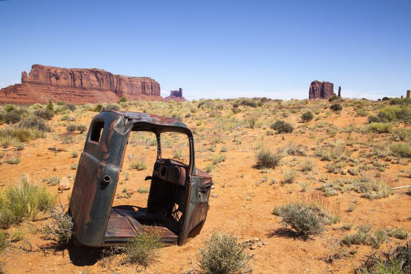 An abandoned truck cab in the Monument Valley desert, Utah. An abandoned truck cab in the Monument Valley desert, Utah