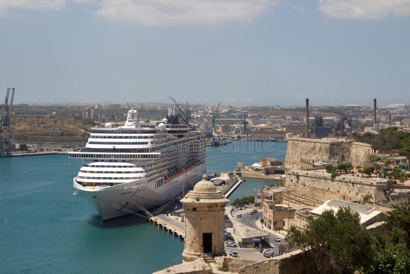 VALLETTA, MALTA - JUNE 6: A Cruise Ship in the Grand Harbor of Valletta, Malta on June 6, 2012. According to MaltaÂ´s National Statistics Office, 1.4 million tourist visited malta in 2011. An increase of 6% from 2010.