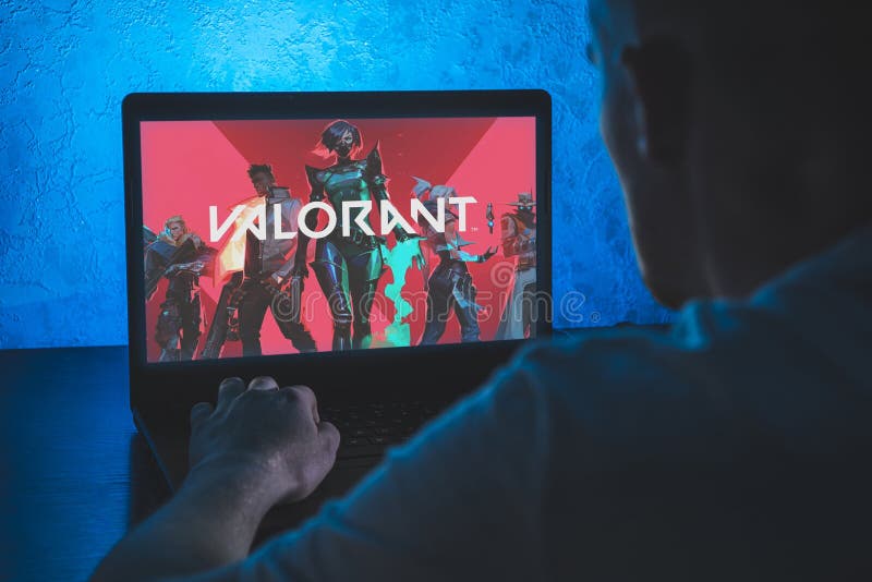 Valorant is a free-to-play first-person hero online shooter. Video computer  game. Man play video game on laptop Stock Photo - Alamy