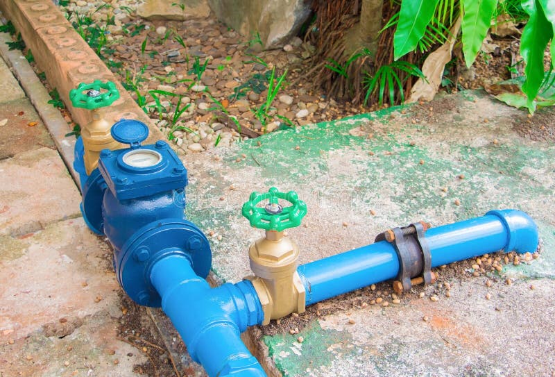 Valves water brass with knob green at connection joint old pipe steel paint blue. on the cement floor outside of the Industrial bu royalty free stock image Valves water brass with knob green at connection joint old pipe steel paint blue. on the cement floor outside of the Industrial bu royalty free stock image