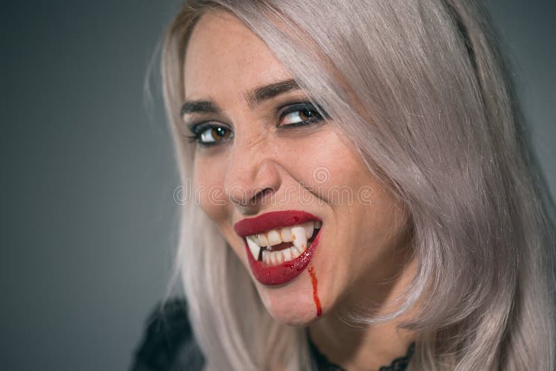 Vampire Woman with a Bloody Mouth and Teeth Fangs Celebrating a Stock ...