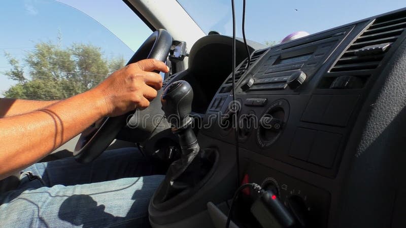 Van dashboard and driver hands close up