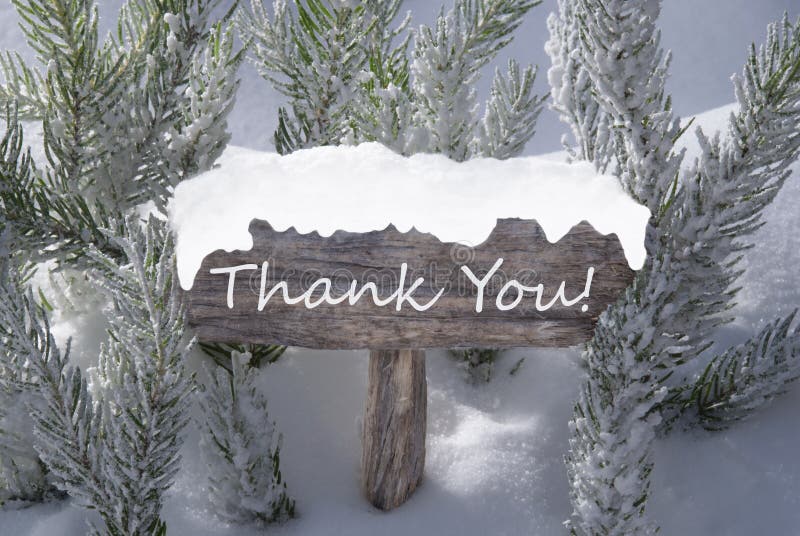 Wooden Christmas Sign With Snow And Fir Tree Branch In The Snowy Forest. English Text Thank You For Seasons Greetings Or Christmas Greetings. Christmas Atmosphere. Wooden Christmas Sign With Snow And Fir Tree Branch In The Snowy Forest. English Text Thank You For Seasons Greetings Or Christmas Greetings. Christmas Atmosphere