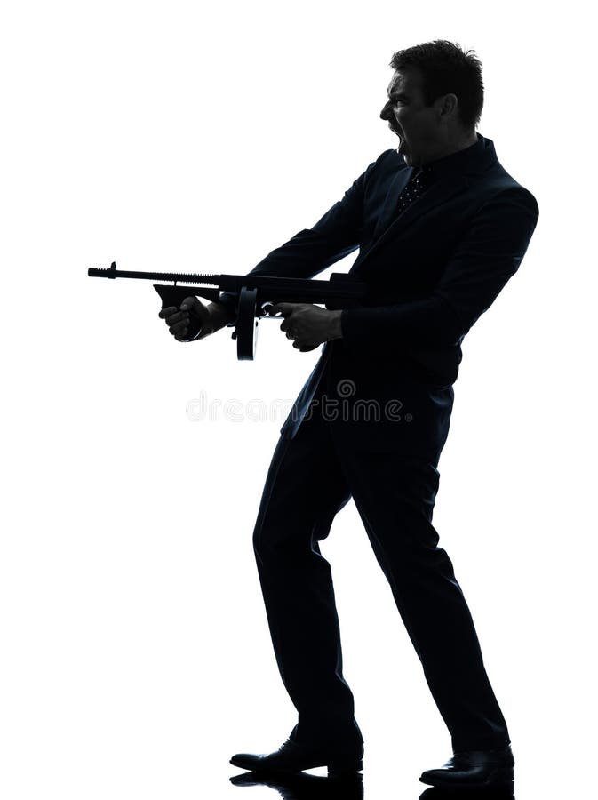 Van de holdingsthompson van de gangstermens het machinegeweersilhouet stock fotografie Van de holdingsthompson van de gangstermens het machinegeweersilhouet stock fotografie