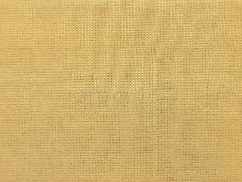 Van de de textuur gouden geel doek van de canvasstof de oppervlaktepatroon, de achtergrond van de stoffendoek stock fotografie Van de de textuur gouden geel doek van de canvasstof de oppervlaktepatroon, de achtergrond van de stoffendoek stock fotografie