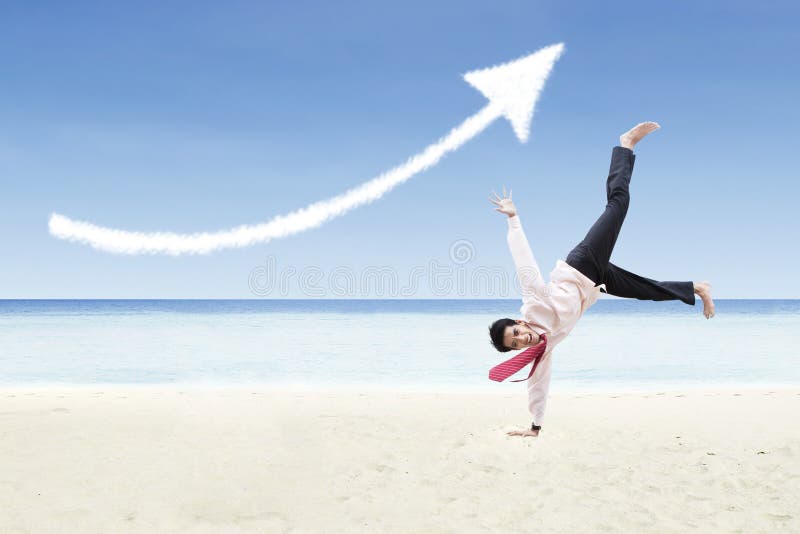 Businessman is dancing under increase arrow sign cloud at beach. Businessman is dancing under increase arrow sign cloud at beach