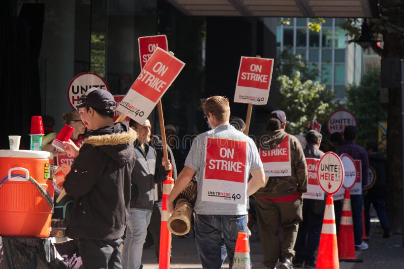 Striking hotel workers block sidewalk in downtown Vancouver