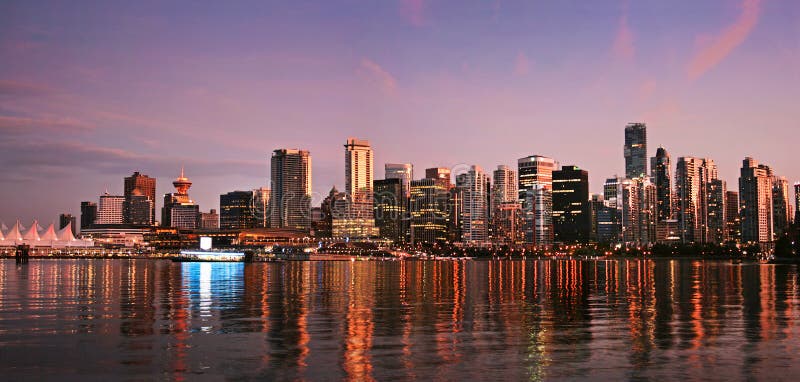Vancouver downtown skyline panorama at sunset as seen from Stanley Park, British Columbia, Canada. Vancouver skyscraper stock images, royalty-free photos and pictures