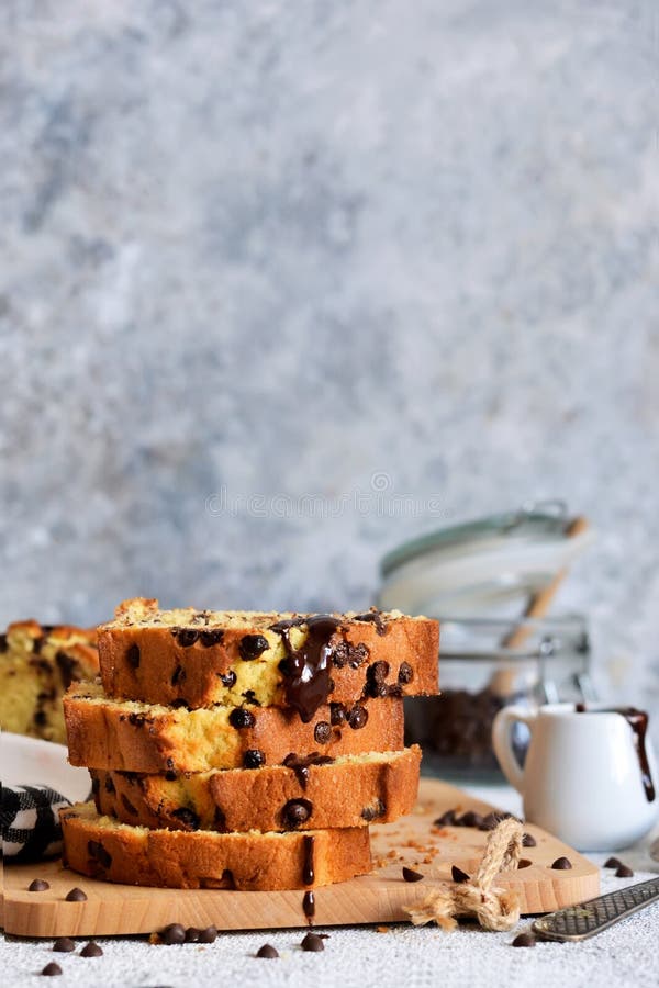 Vanilla bread with chocolate drops on the kitchen table. Slices of cake royalty free stock photo Vanilla bread with chocolate drops on the kitchen table. Slices of cake royalty free stock photo