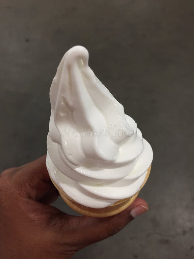 Vanilla cone ice cream stock photo. Image of holding 141741624
