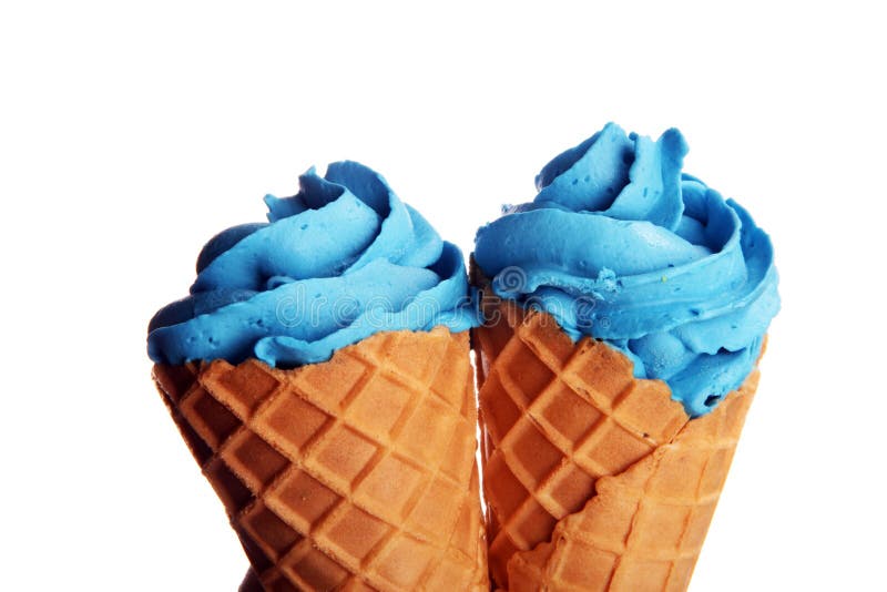 Vanilla frozen yogurt or colorful soft ice cream in waffle cone