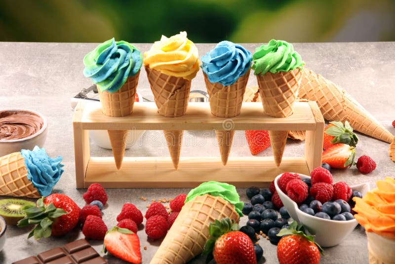 Vanilla frozen yogurt or colorful soft ice cream in waffle cone