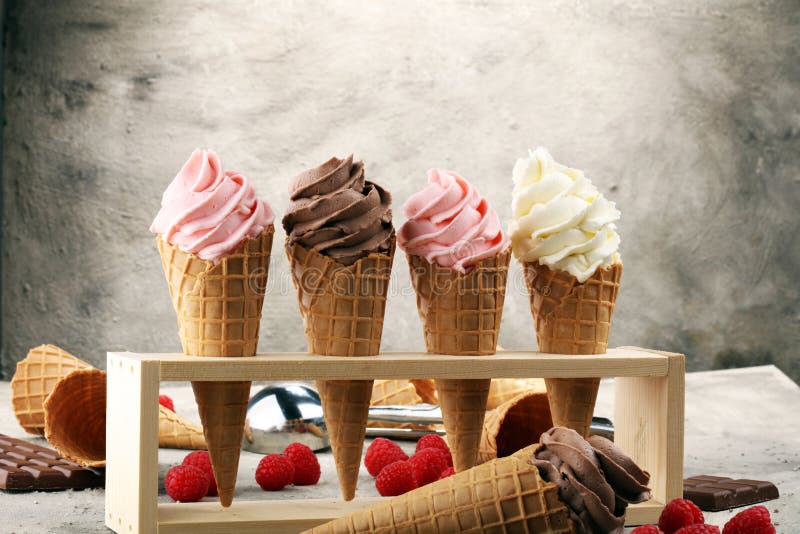 Vanilla frozen yogurt or soft ice cream in waffle cone.