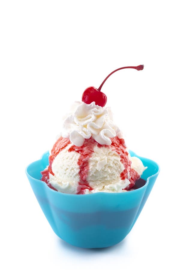 A Vanilla Ice Cream Sundae with Strawberry Sauce Whipped Cream and a Cherry On Top