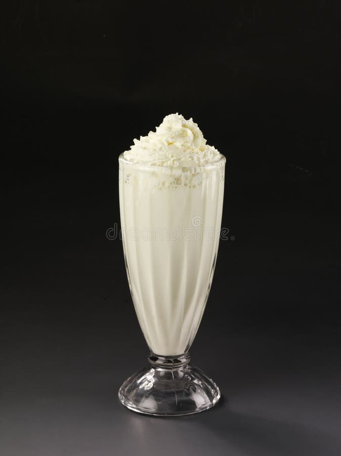 Vanilla Milkshake in Plastic Glass on a Dark Background. Vanilla