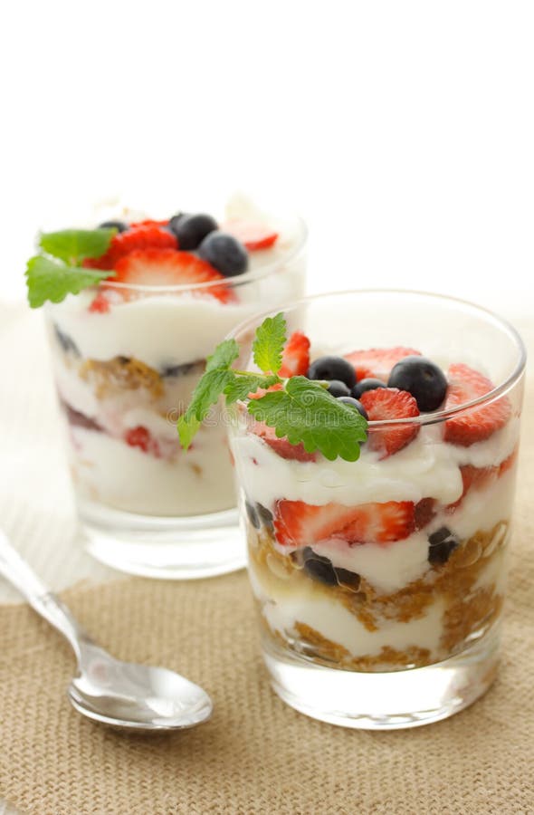 Vanilla yogurt over strawberries and blueberries