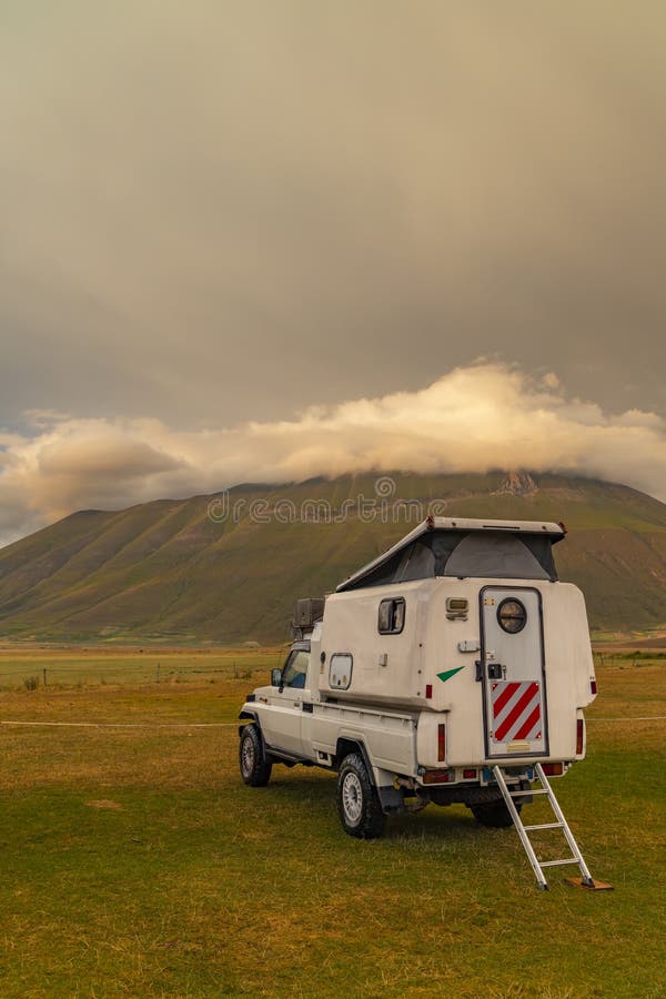 vanlife near Castelluccio village in National Park Monte Sibillini, Umbria region, Italy