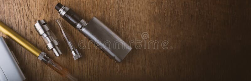 Vape pen and vaping devices, mods, atomizers, e cig, e cigarette royalty free stock photos Vape pen and vaping devices, mods, atomizers, e cig, e cigarette royalty free stock photos