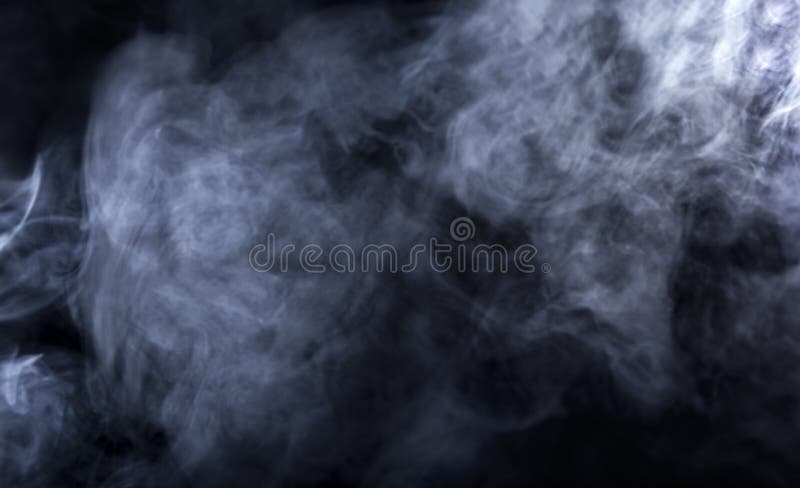 Smoke from a Vape with light effects on a black background. The image is an abstract texture with copy or text space. It has patterns showing movement and depicts a spooky mood with a Halloween theme. Smoke from a Vape with light effects on a black background. The image is an abstract texture with copy or text space. It has patterns showing movement and depicts a spooky mood with a Halloween theme.