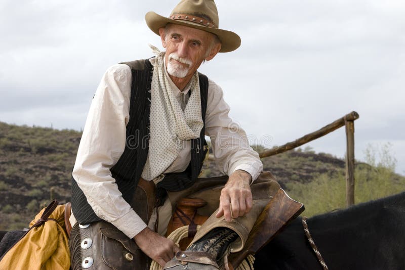 Vaquero americano occidental del viejo Cowhand fotografía de archivo libre de regalías Vaquero americano occidental del viejo Cowhand fotografía de archivo libre de regalías
