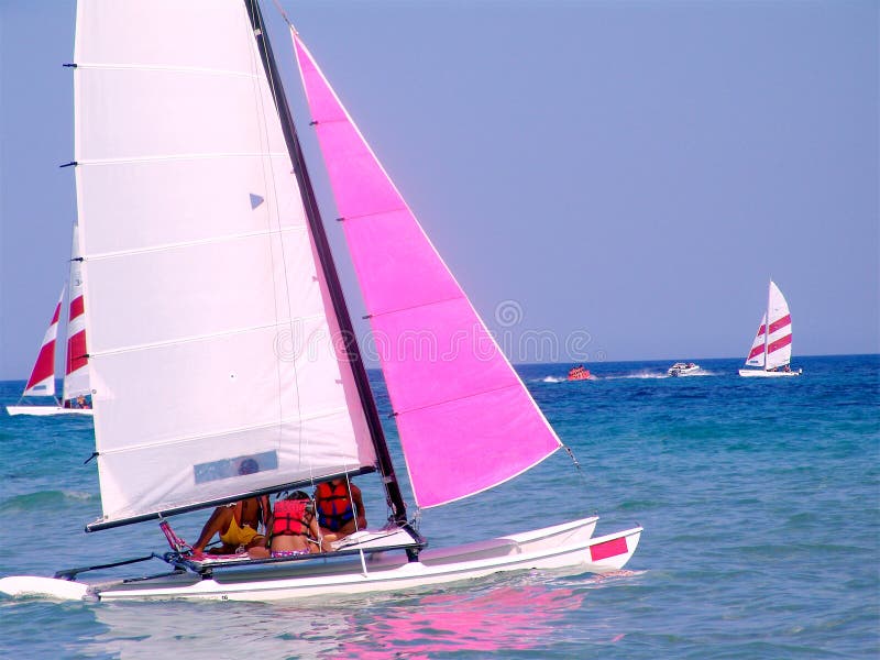 Sailboats in blue waters of Mediterranean Sea off coast of Tunisia on sunny day. Sailboats in blue waters of Mediterranean Sea off coast of Tunisia on sunny day.