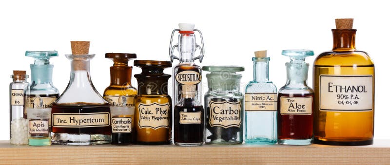 Various pharmacy bottles of homeopathic medicine on wooden board. Various pharmacy bottles of homeopathic medicine on wooden board