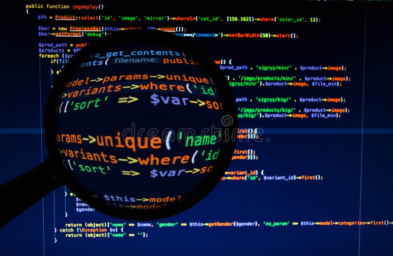 Front view of the varicoloured php code under magnifier. Source code script stock images, royalty-free photos and pictures