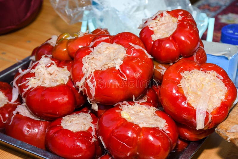 Varied assortment of pickles like red peppers stuffed with cabbage