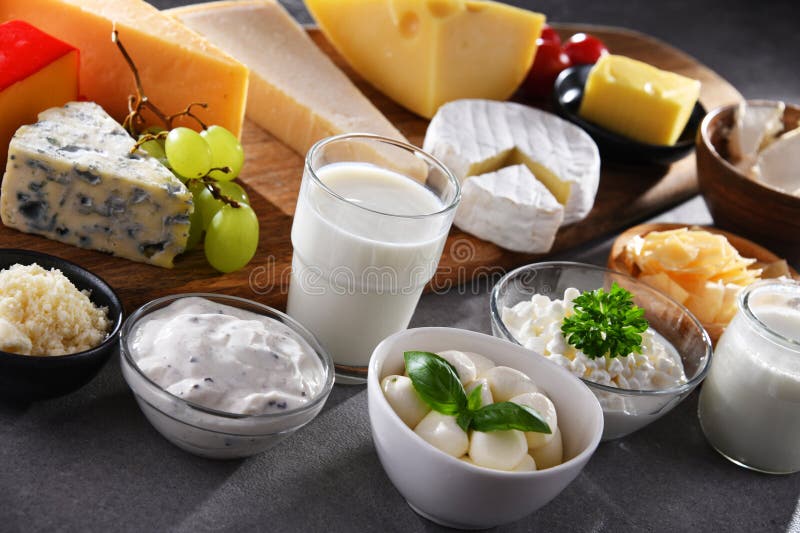 A Variety of Dairy Products Including Cheese, Milk and Yogurt Stock