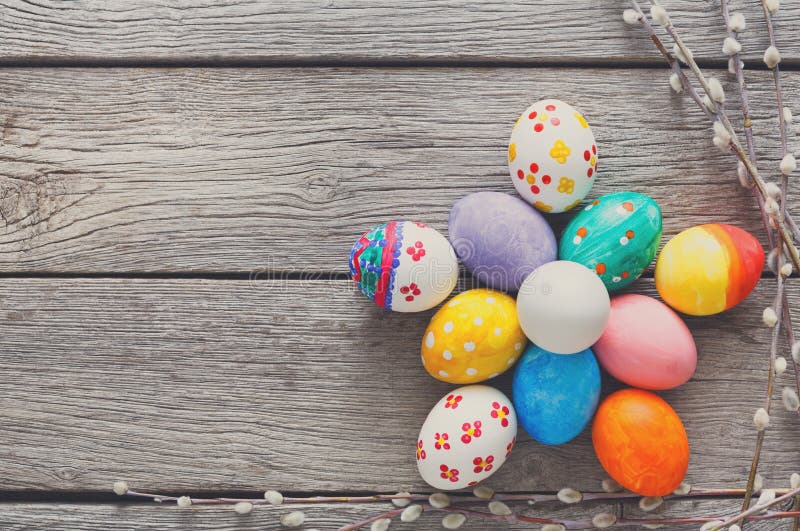 Colorful Decorated Easter Eggs Arranged on a Wooden Table With Spring Decor royalty free stock photos
