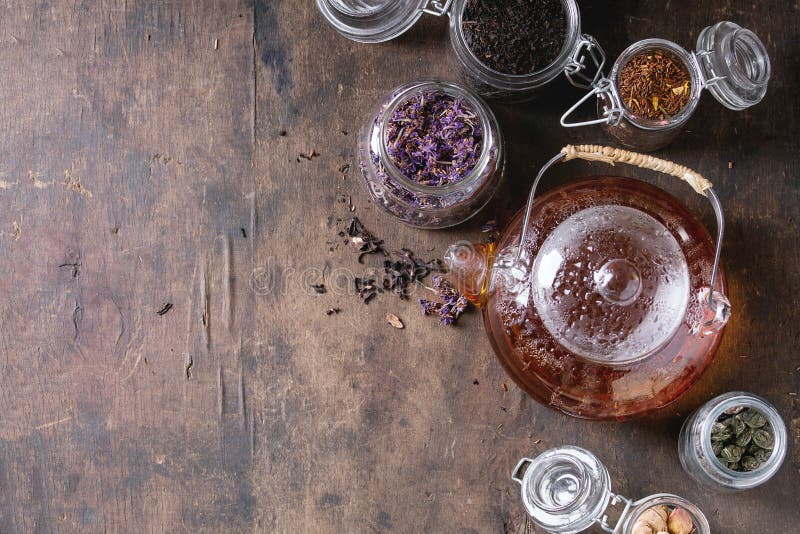 Variety of dry tea with teapot