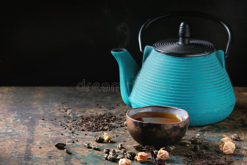 Variety of dry tea with teapot