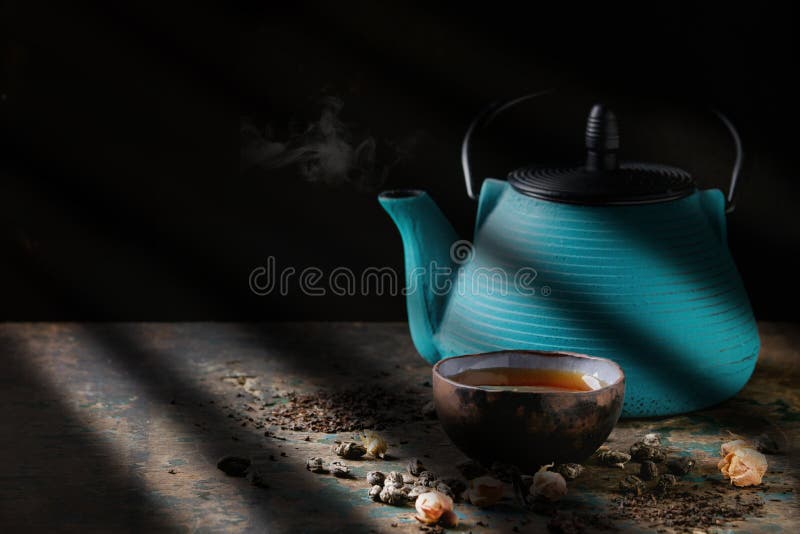 Variety of dry tea with teapot