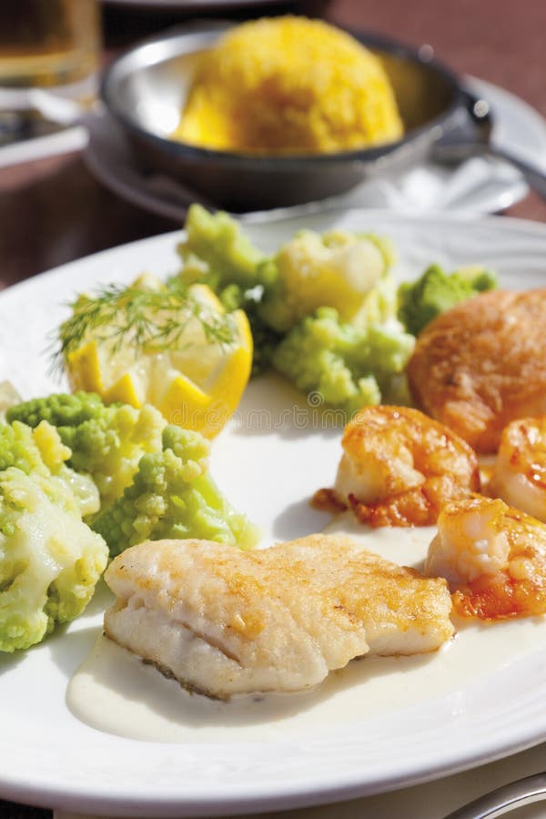 Variety of Fish and Fillet is Served with Saffron Rice in Plate Stock Image Image of prawns