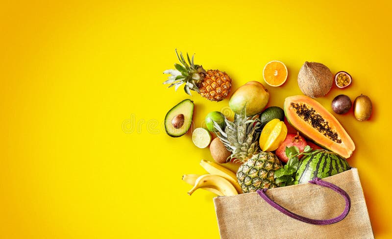 Variety of fresh tropical fruit on exotic yellow royalty free stock photo Variety of fresh tropical fruit on exotic yellow royalty free stock photo