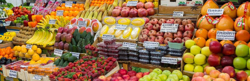 A variety of fruits and berries on the counter on the market stock images A variety of fruits and berries on the counter on the market stock images
