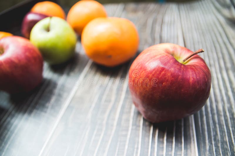 Variety fruits with red apples Green apples and oranges stock images