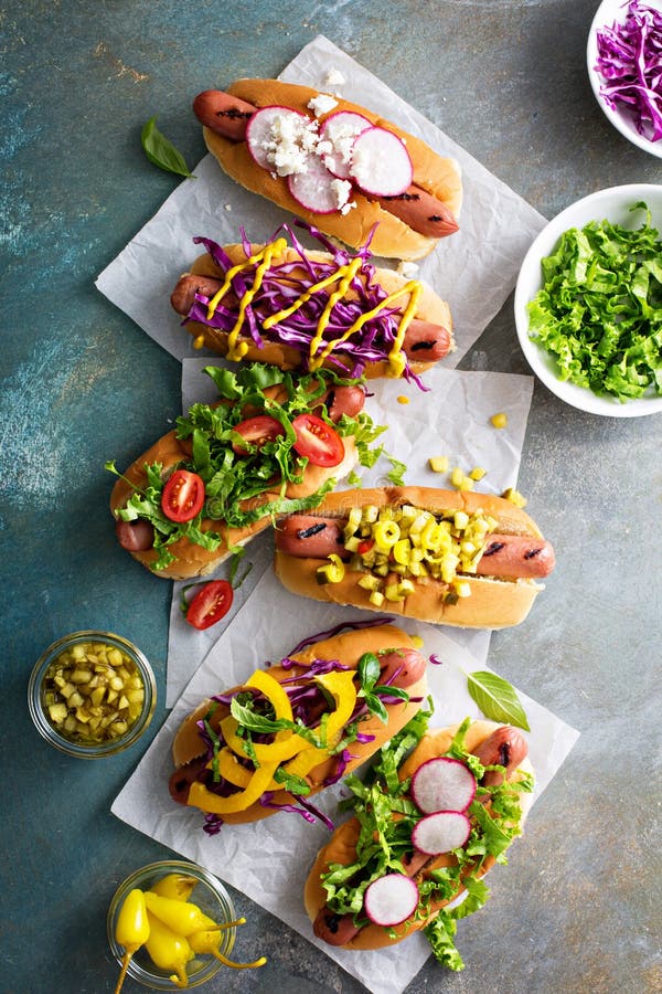 Variety of hot dogs with healthy garnishes