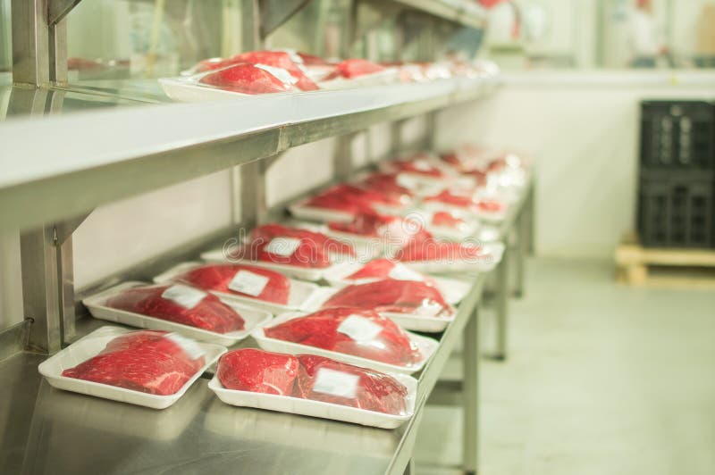 Variety of meat in plastic boxes in supermarket stock photography