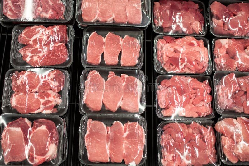 Variety of meat slices in boxes