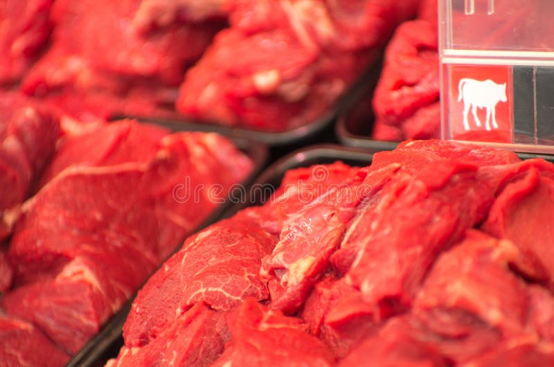 Variety of meat slices in boxes in supermarket