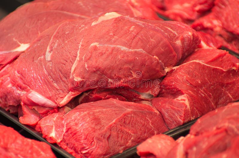 Variety of meat slices in boxes in supermarket