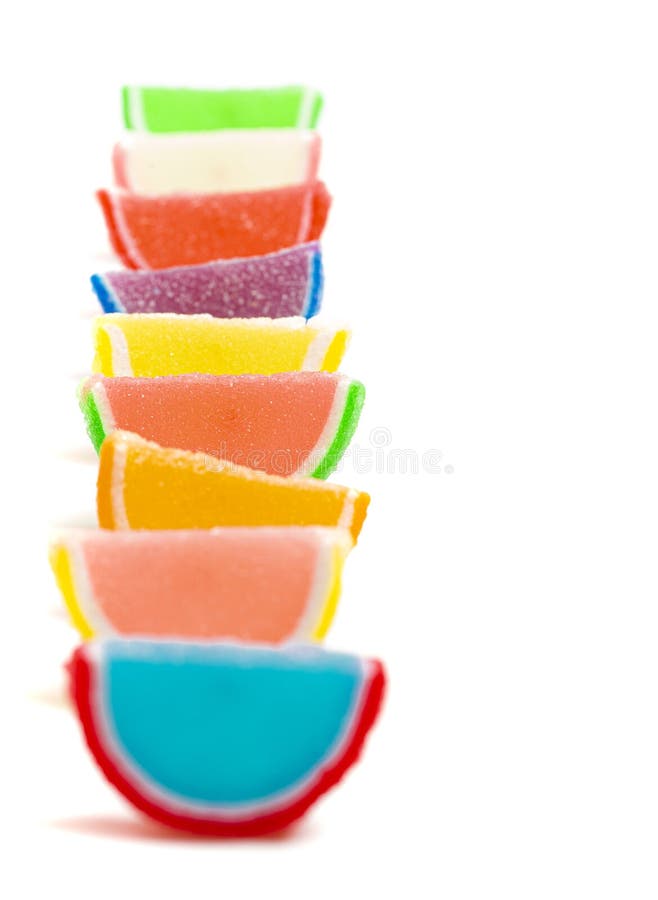 A Variety of Multicolored Candy Fruit Slice on a White Background Stock
