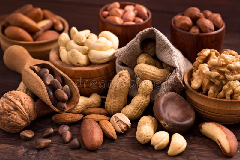 Variety of nuts. Different types of nuts: walnut, hazelnut, cashew, peanuts; brazil nuts, pine nuts and other stock image