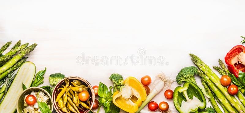 Variety of organic vegetables ingredients with asparagus and feta for delicious seasonal cooking , white wooden background, top vi royalty free stock image Variety of organic vegetables ingredients with asparagus and feta for delicious seasonal cooking , white wooden background, top vi royalty free stock image